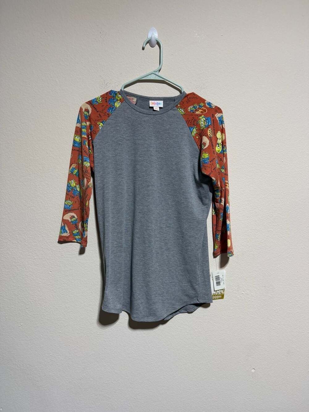 LuLaRoe Disney Toy Story Alien Raglan Shirt Size XS